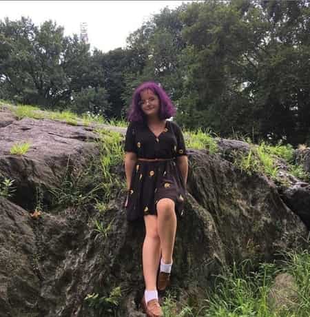 Milly Shapiro outdoors posing for a photo